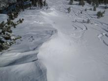 NE winds scouring N/NE aspects and moving snow along ridge.