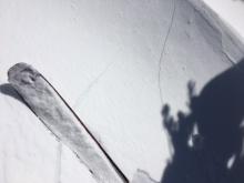 Small localized cracking in wind loaded terrain from E winds.  9600', SW aspect.