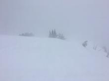 Blowing snow limited to the ridgetop. Poor visibility.