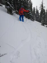Skier triggered shooting cracks resulting from a storm slab instability on an undercut slope.