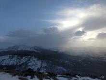 Increasing clouds and some light precipitation over the Sierra Crest in the late afternoon.