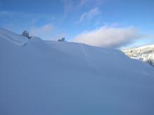 Typical entrainment of new snow from intentional cornice collapse.