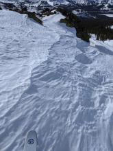 Wind textured firm snow on a NW aspect
