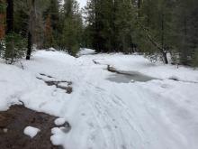 Castle Valley Road has thin snow coverage and quickly melting out.