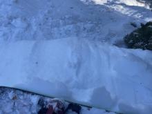 Small debris pile of wet surface snow failing on facets below.