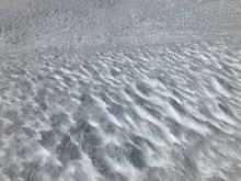 The more west facing this generally south facing terrain was, the more roughly textured the snow surface was. 