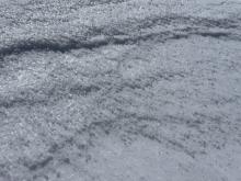 Graupel layer exposed from wind erosion.