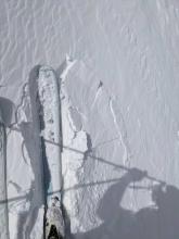 Cracks around a very small wind crust