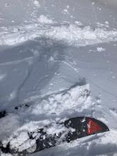 A semi protected near treeline test slope with failure directly below my ski but no propagation.