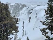 Over-hanging cornice development near tree line. Also a small wet loose debris pile at the bottom of cornice from today.