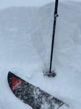 Looking at the depth of the broken cornice near the summit. 