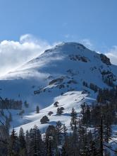 Blowing snow on The Nipple, towards the sunset 