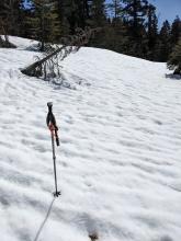 Runnels in the snow surface indicate melt water draining through the snowpack. 